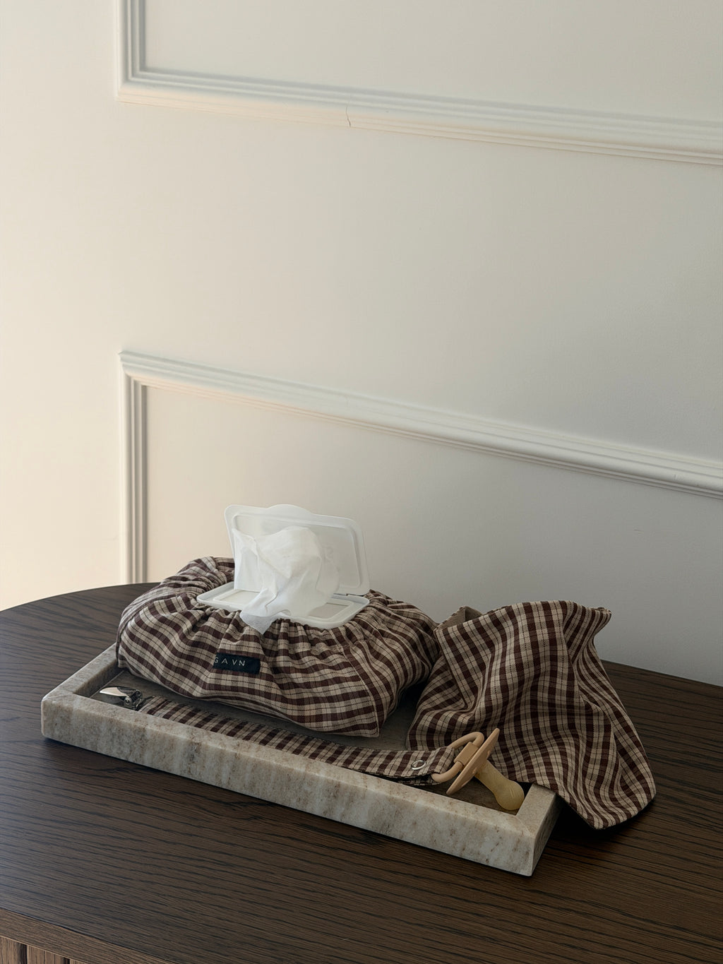 Cortado wet wipes case and bib on a stone tray