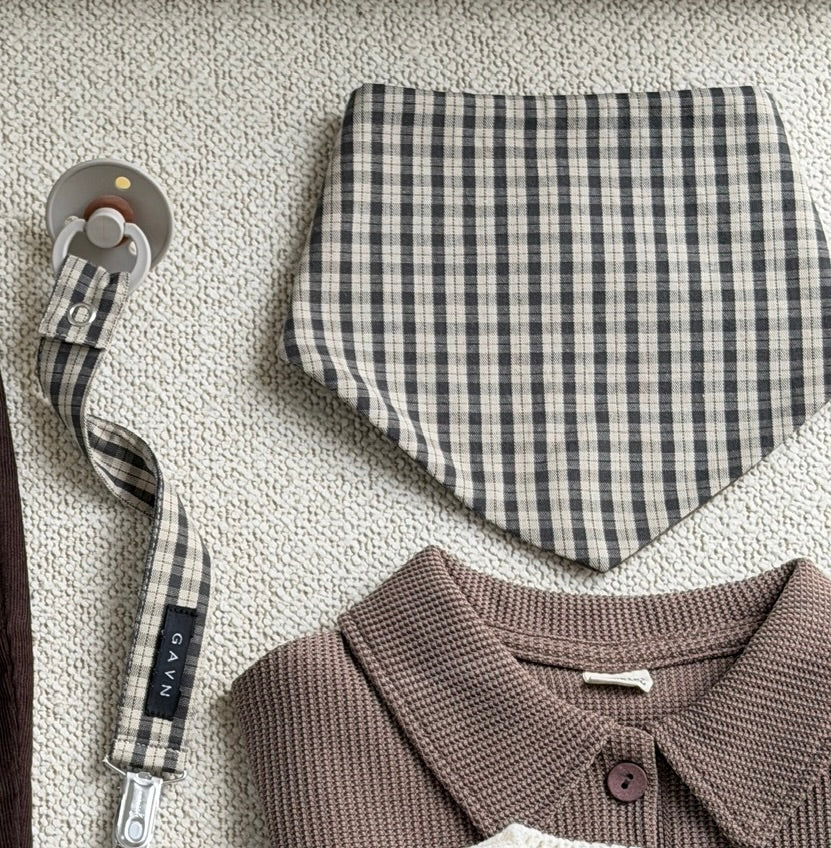 Mocca dummy clip in brown check cotton with bib and brown polo shirt